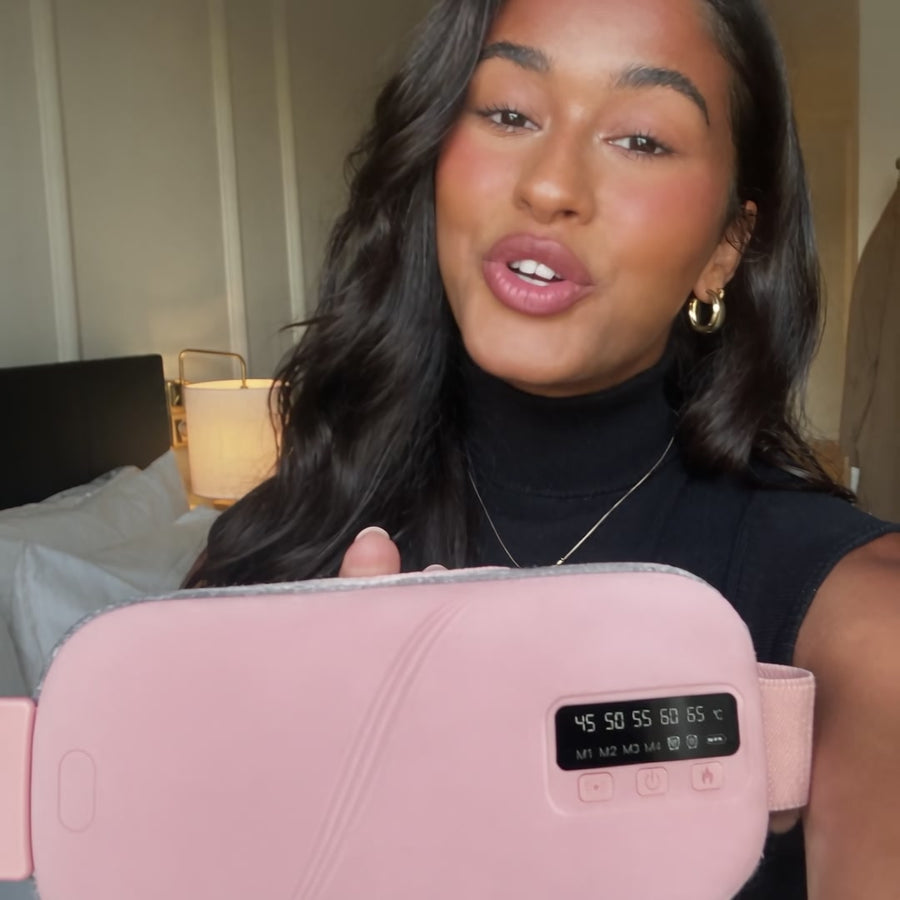 Holding the Mello Soothe belt up to the camera